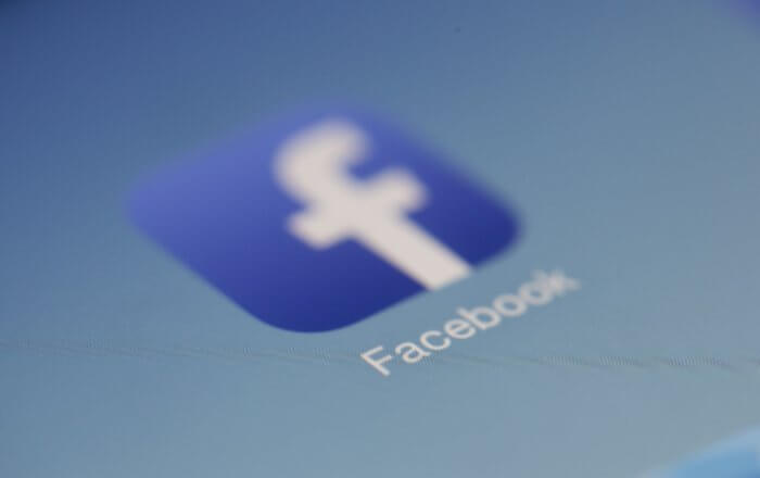 Facebook logo on smartphone screen